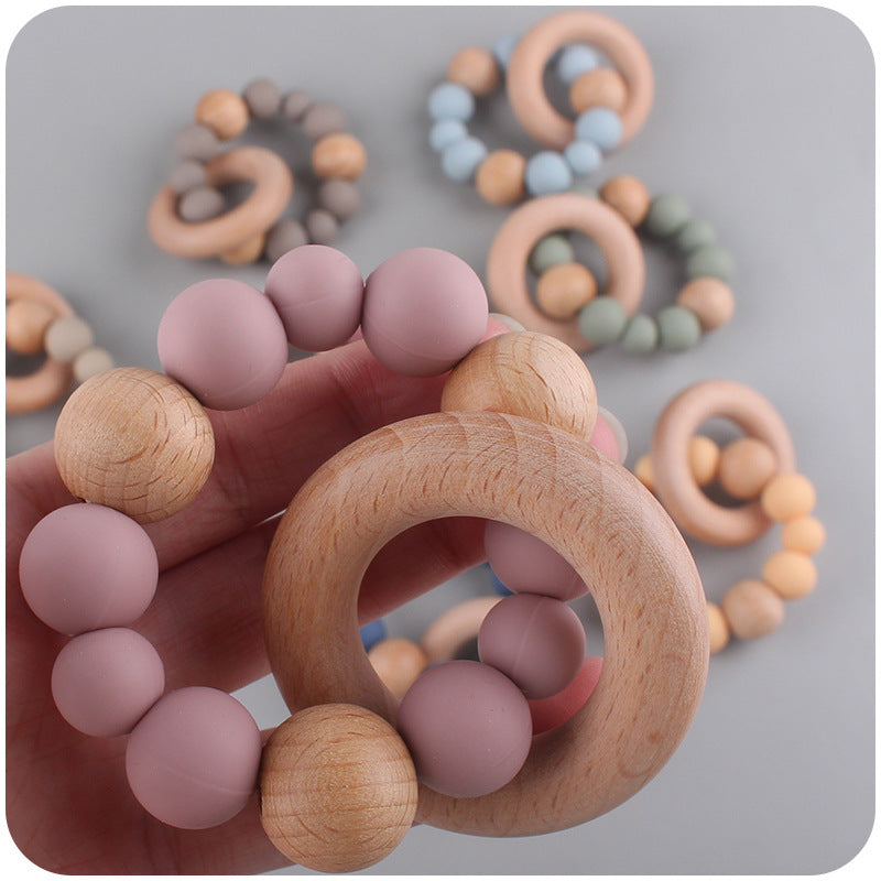 Bit toy, beads in wood and silicone